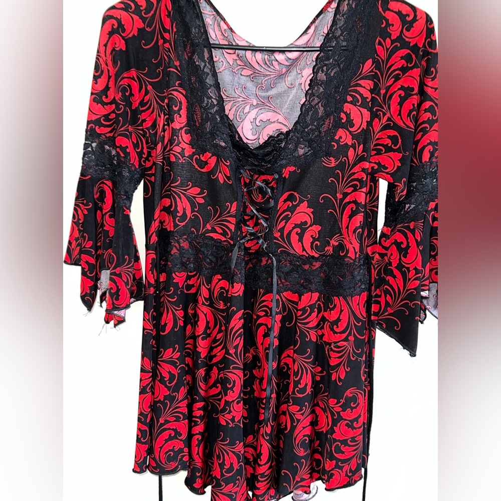 super cute black and red flared sleeved dress with ties in the from and back!